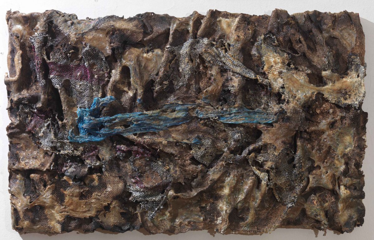 Mixed media on canvas:  Burned  materials  -textiles-  resins-   and plastic. Dimensions 70X42.