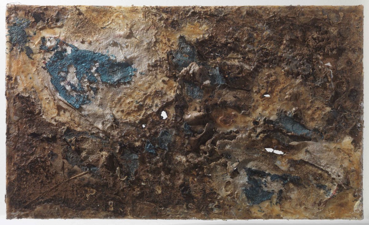 Mixed media on canvas:  Burned  materials  -textiles-  resins- and plastic. Dimensions 70X42.